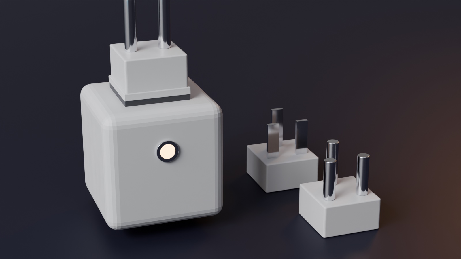 A white travel adapter with one plug head fitted and two others beside it; all three bases are identical